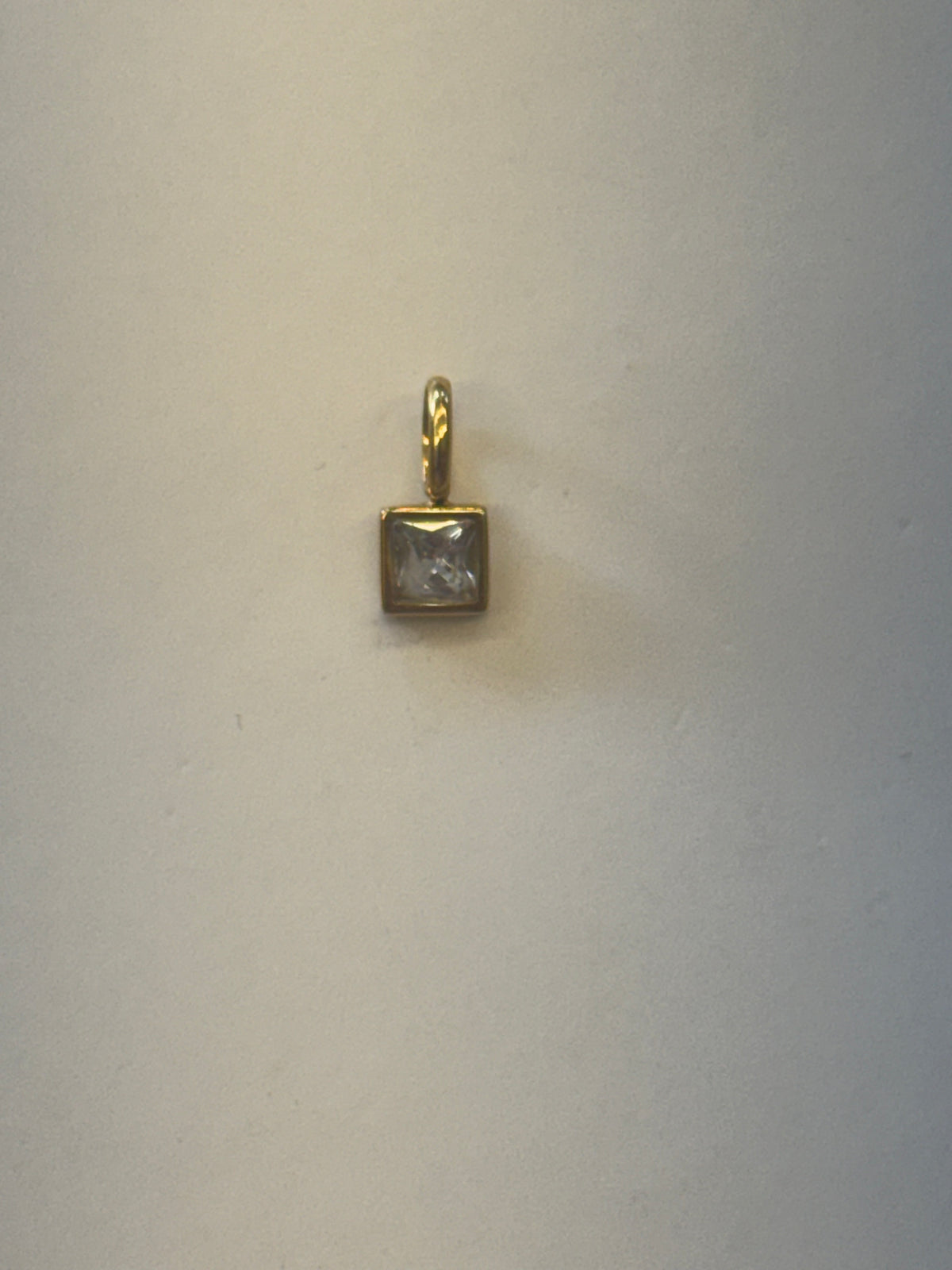 White stone charm