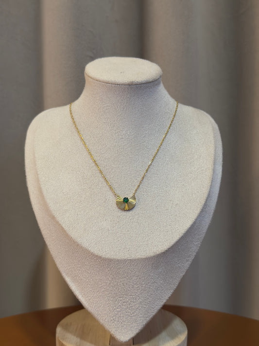 Elegant gold anti-tarnish necklace featuring a fan-shaped pendant with a sparkling emerald green crystal centerpiece on a delicate chain.