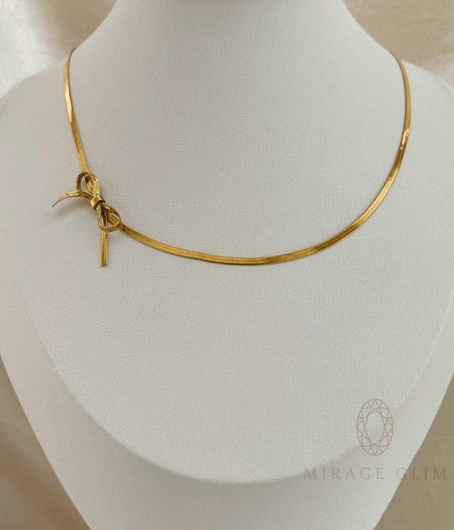 Gold knot necklace with sleek minimal chain design