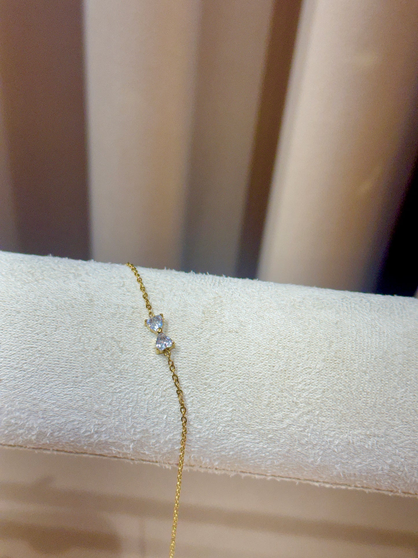White bow bracelet gold