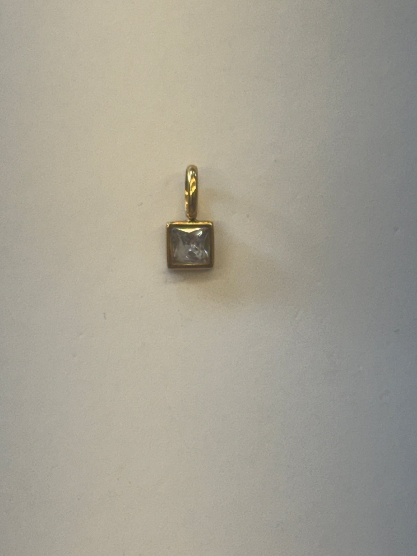 White stone charm
