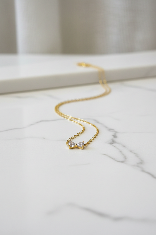Bow white stone gold necklace