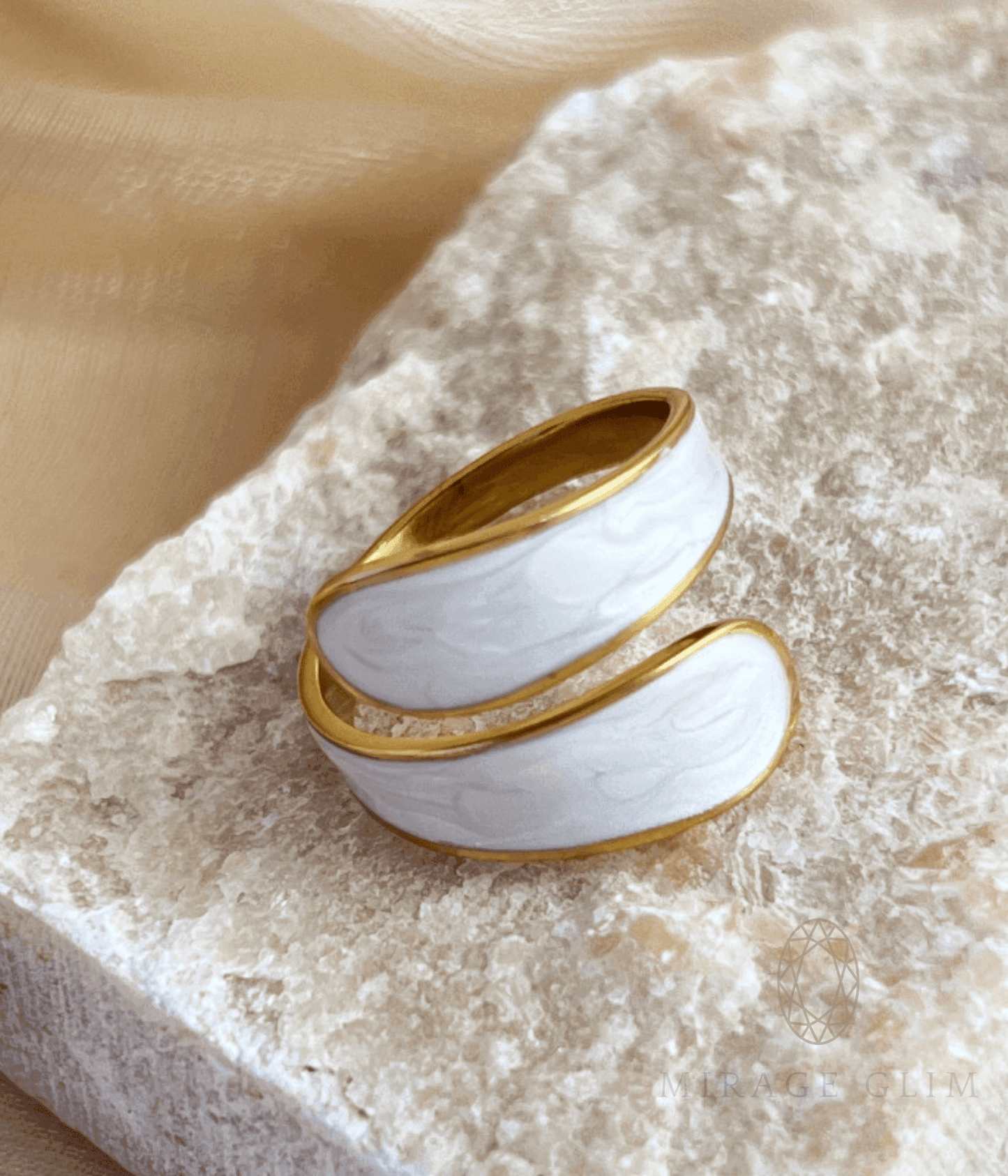 wrap ring with smooth white enamel and soft layered curves.