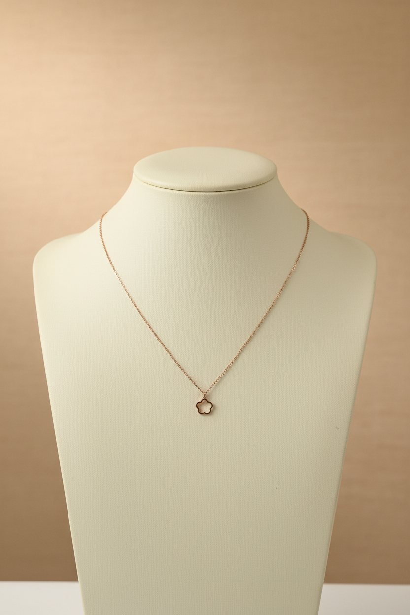 Necklace with a small pendant on a textured gray surface
