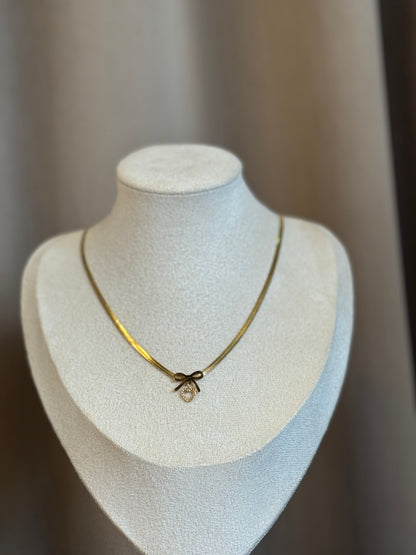 Heart and bow necklace
