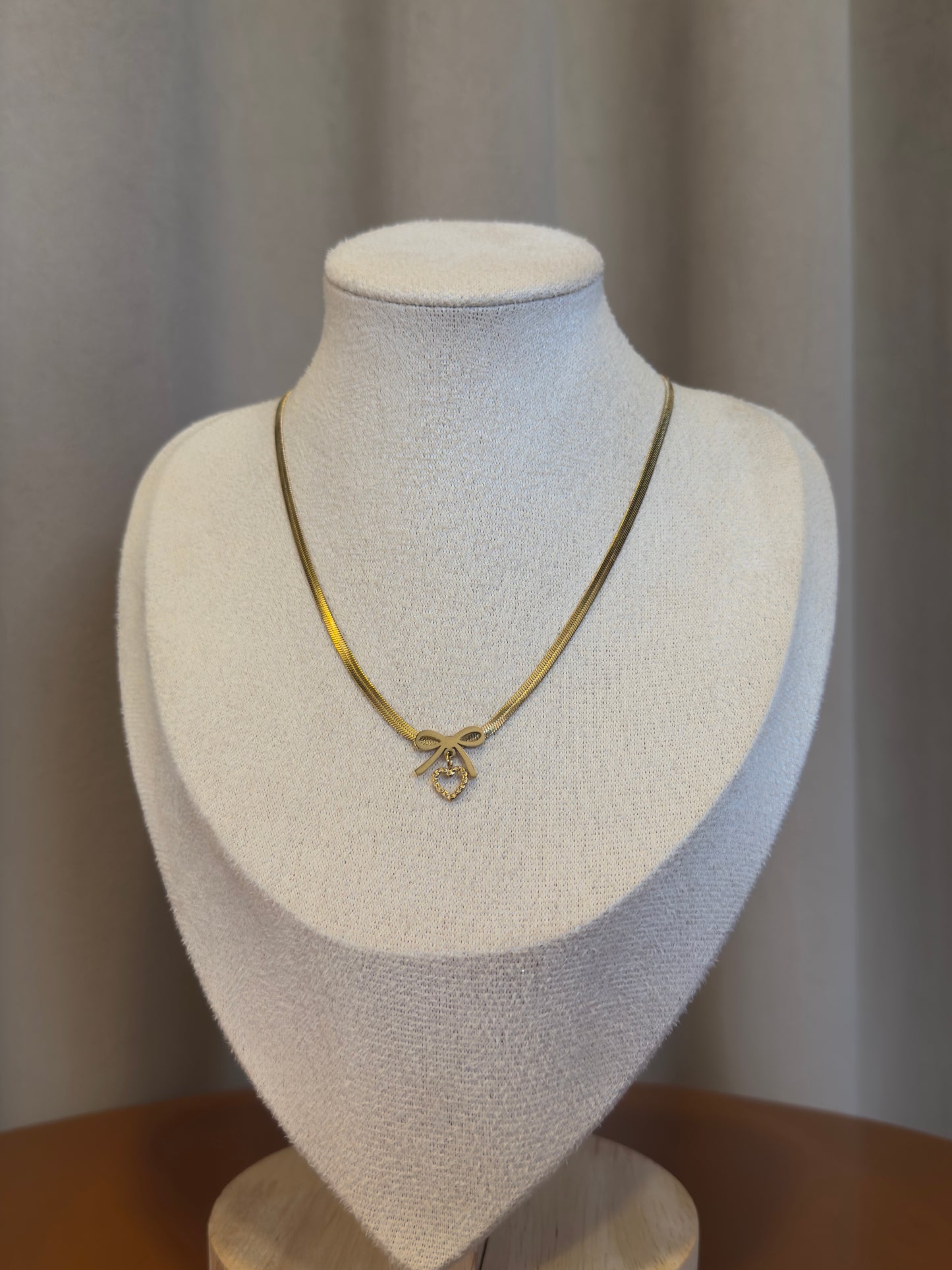 Heart and bow necklace
