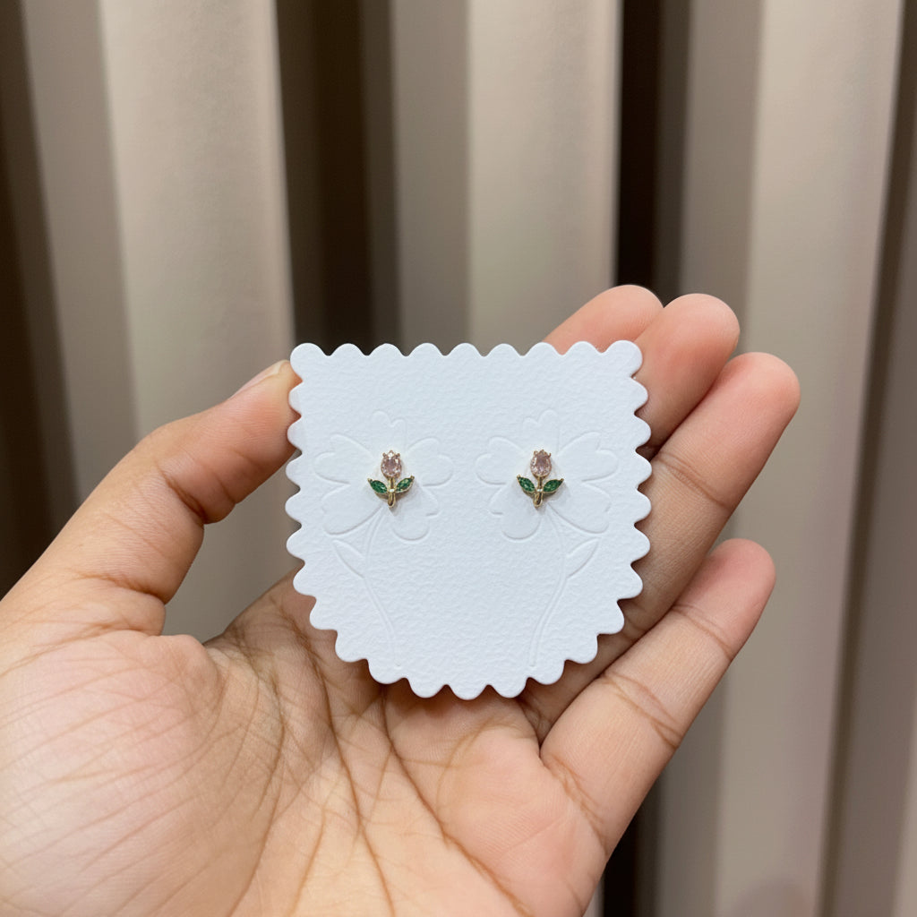 Crystal Rose Stud Earrings with pink zirconia bud and green leaf accents