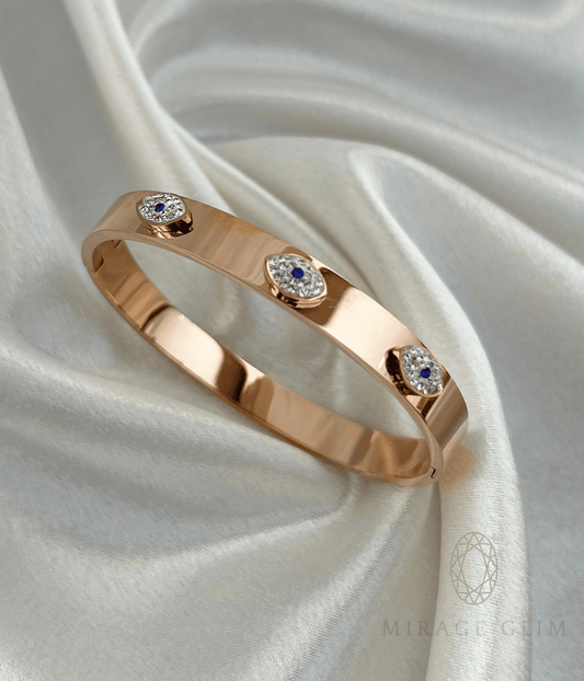evil eye cuff bracelet with blue and crystal accents on satin fabric