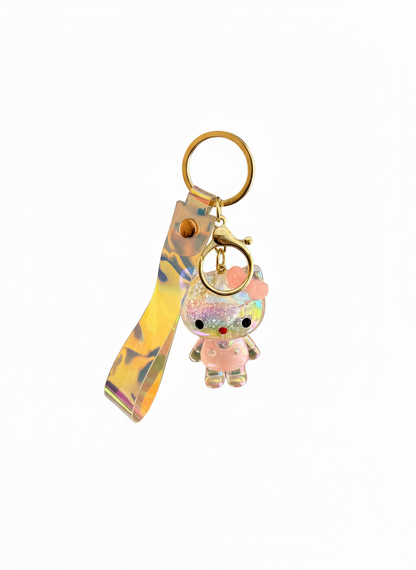 Keychain with a small character charm and colorful strap on a white background