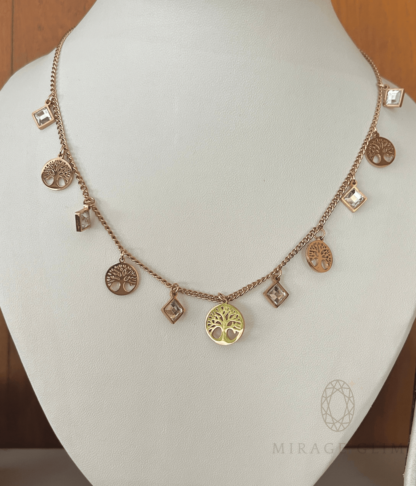 Necklace with various charms on a mannequin bust