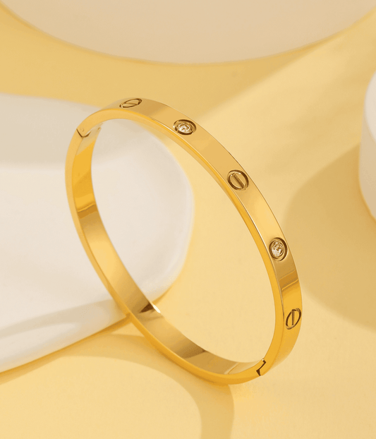 Polished gold crystal screw bangle bracelet featuring a timeless luxury design, perfect for elegant everyday and occasion wear