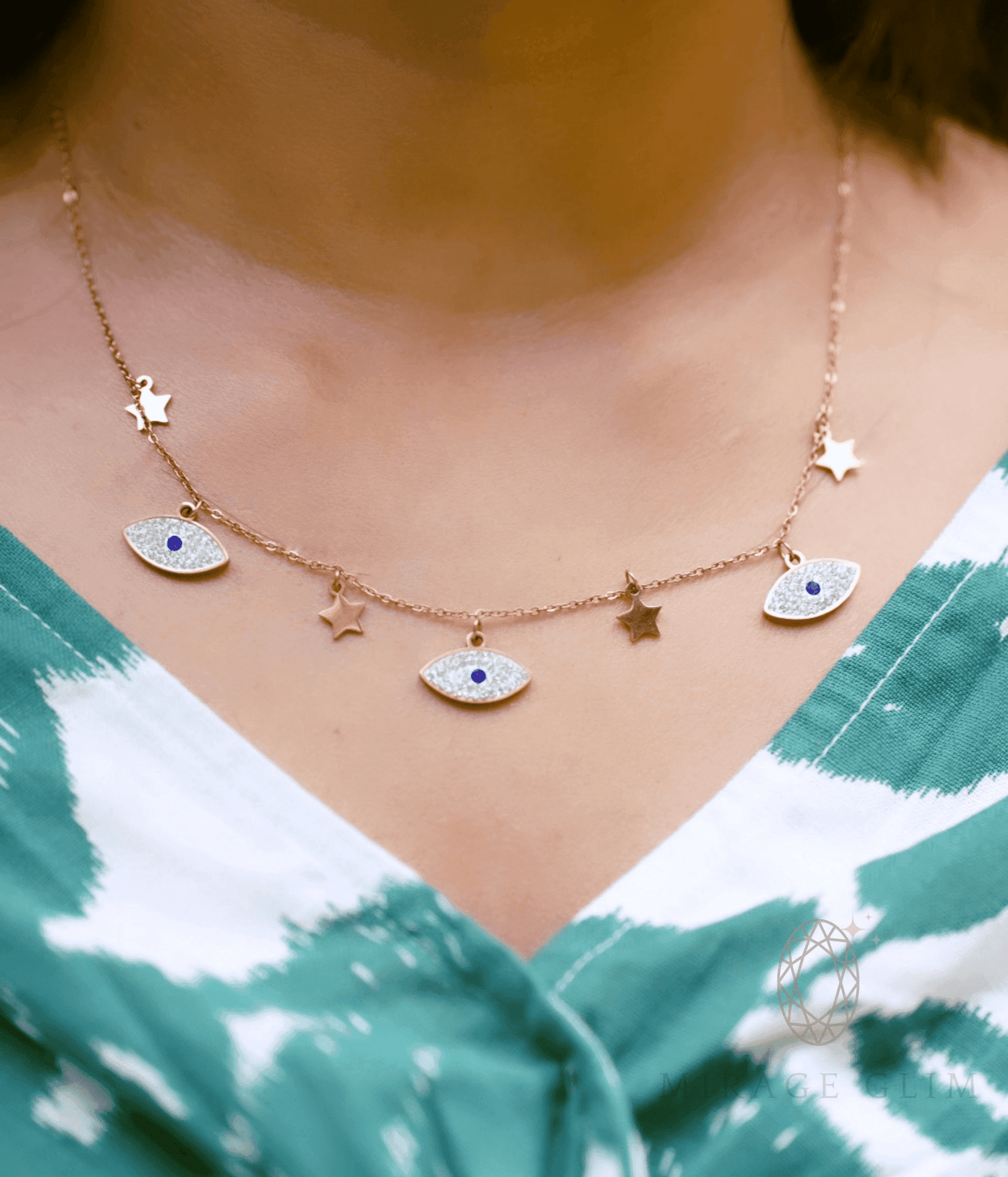 Minimal evil eye necklace with star accents styled casually
