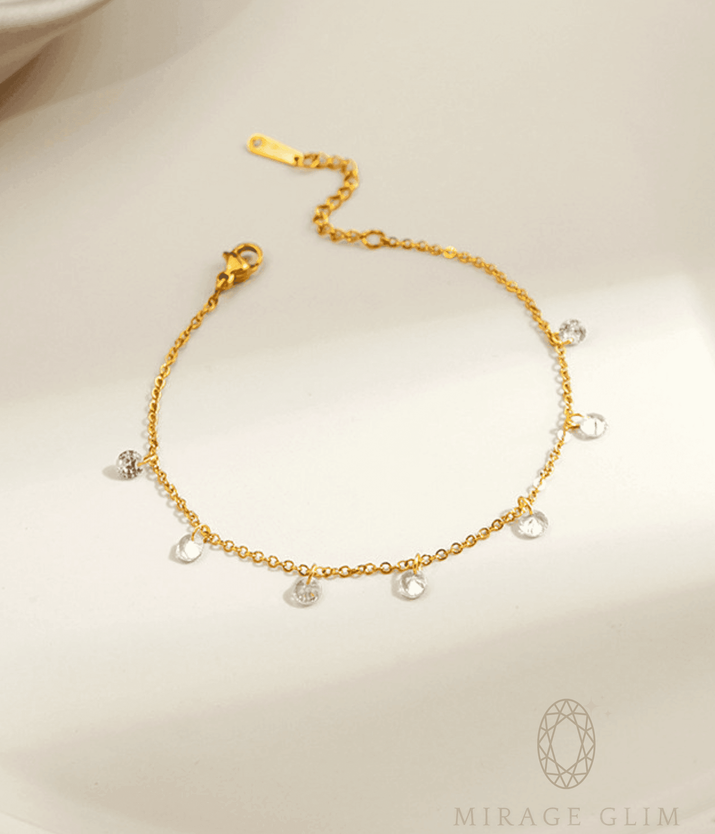 Anklet with delicate clear drop details on fine chain.