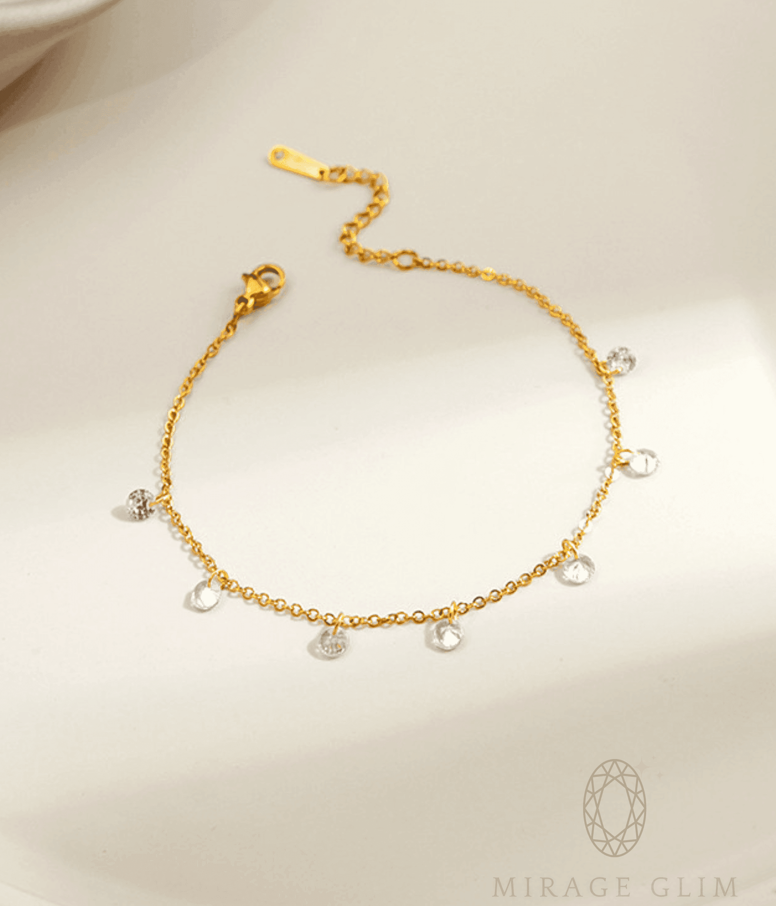 Anklet with delicate clear drop details on fine chain.