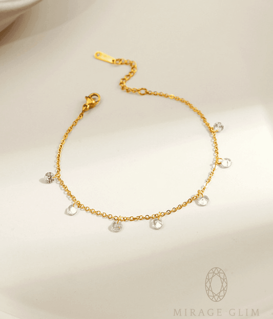 Anklet with delicate clear drop details on fine chain.