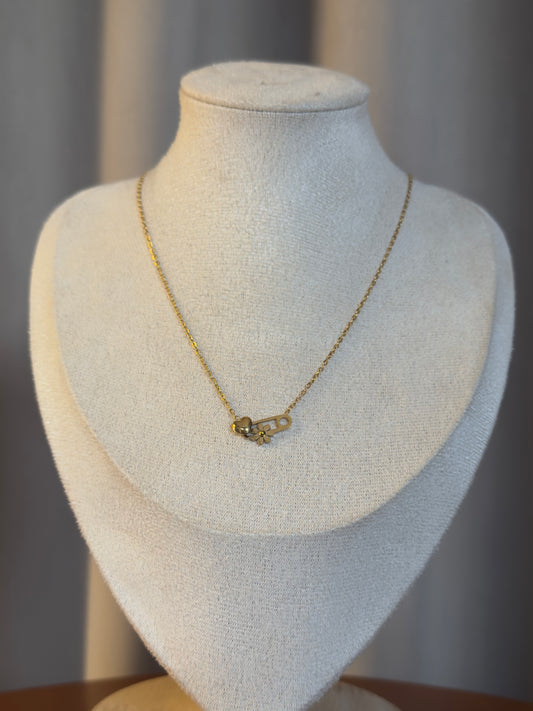 Minimalist gold anti-tarnish necklace featuring a lock-inspired pendant with delicate crystal accents on a fine gold chain.