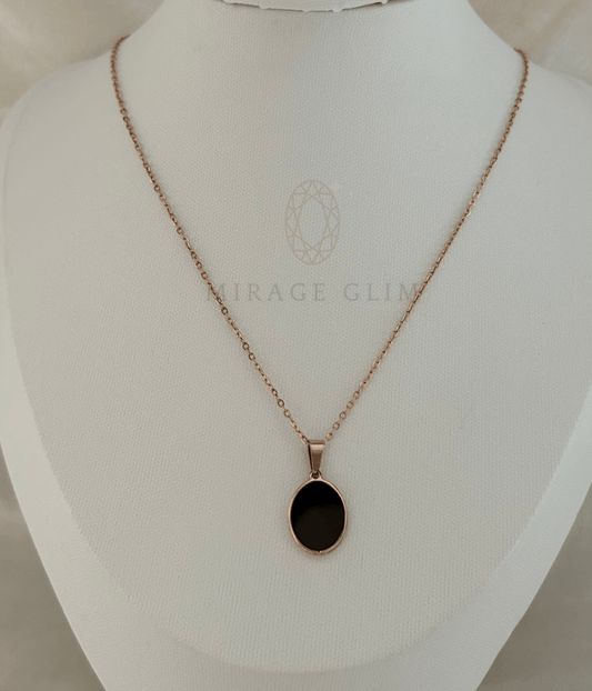 Black oval pendant necklace on rose gold tone chain