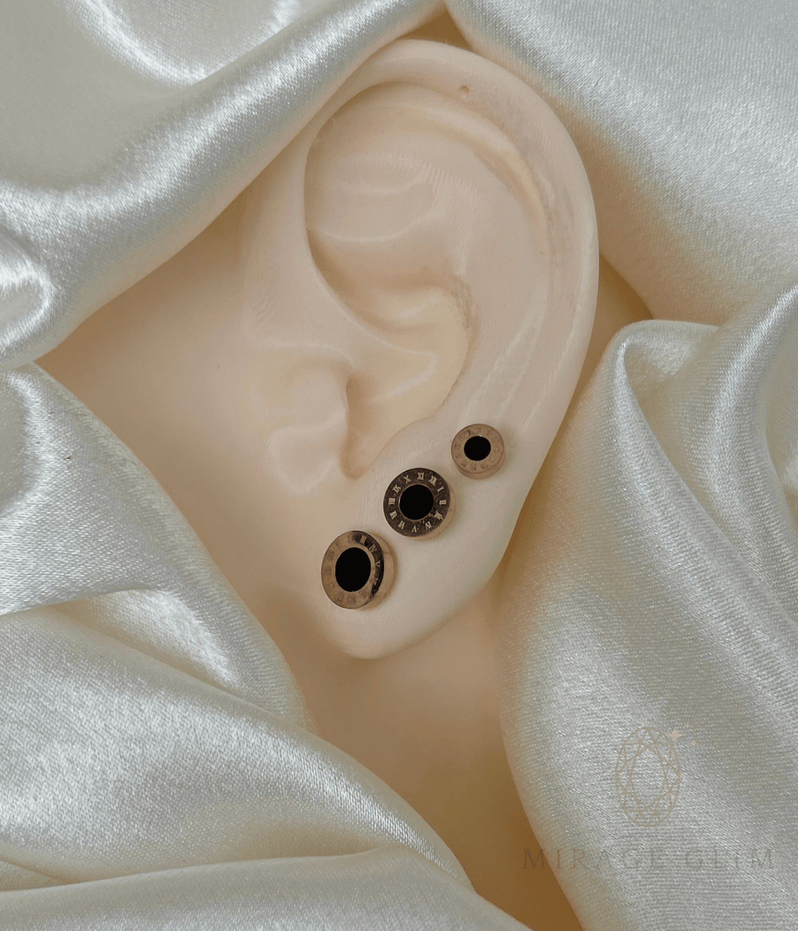 Roman Orbis circular stud earrings with black center design