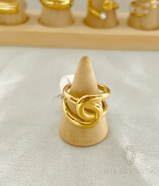 Twisted gold statement ring with modern sculptural design